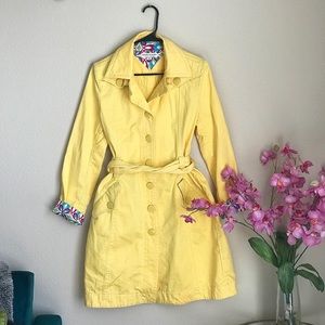 Yellow trench coat with belt
